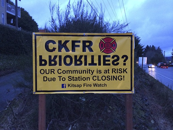 A neighborhood group known as 'Kitsap Fire Watch' has posted a sign at Silverdale Way and Knute Lane to bring attention to the fact that they think the CKF&R administration's priorities are upside down. The sign is in response to a new 17 minimum firefighter standard in the district. That minimum also resulted in Central Kitsap Fire and Rescue’s Station 64
