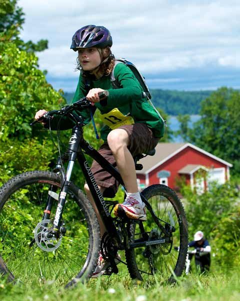 Kingston’s Dylan Chandler crests the ridge after climbing a steep trail from the beach