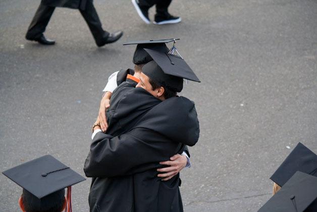Two graduating seniors hug as the CKHS class of 2013 gathers outside the pavilion just before graduation.