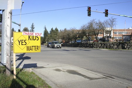 The words “Thank You” cover a Central Kitsap School District capital projects levy sign Wednesday across the street from Central Kitsap High School in Silverdale. The $58 million capital projects levy was passing with a 52.75 percent approval Wednesday evening.