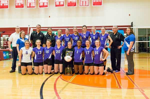 The 2013 North Kitsap varsity volleyball team poses with their fifth-place 2A State trophy Nov. 16 after defeating the Tumwater Thunderbirds.
