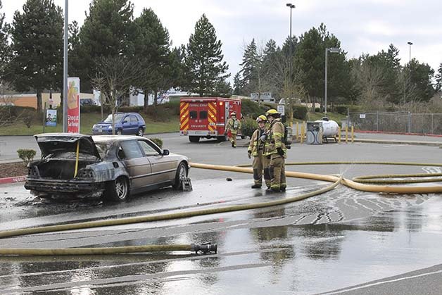 Central Kitsap Fire and Rescue firefighters respond to a car fire in Bremerton. The car caught on fire while the driver was in traffic.