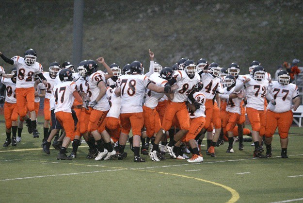 The Central Kitsap High School football team celebrates following a 21-12 victory over Olympic High School in the Battle of Bucklin Hill in 2007.
