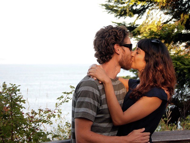 Steve Plantz and Jeny Rae share a romantic smooch at Rockaway Beach on Bainbridge Island