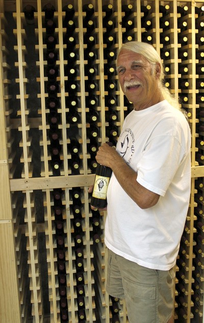 Olalla Valley Vineyard and Winery owner Joe Serka displays his cellar.