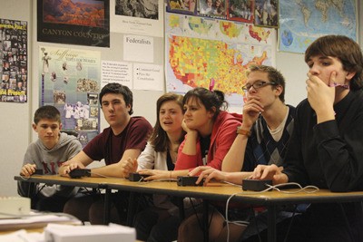 Students of Klahowya Secondary School's History Bowl team practice a few round of questions last week after school. The school will host the state championships of the National History Bowl and Bee Saturday.