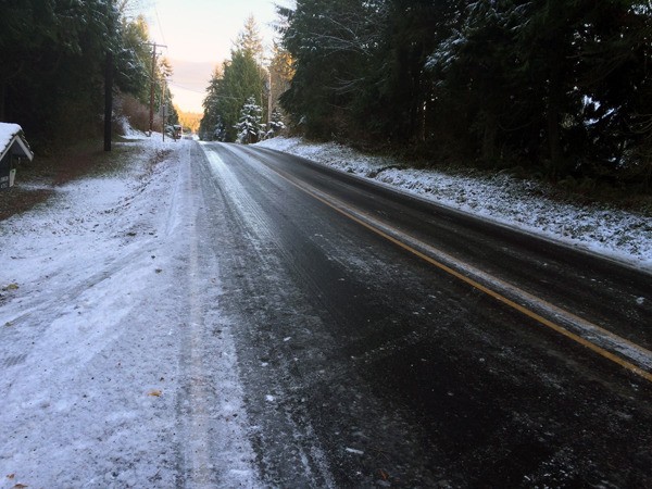 Twin Spits Road in Hansville was covered in a layer of treacherous ice late Nov. 29. Fire and safety officials advised residents to stay home if possible.