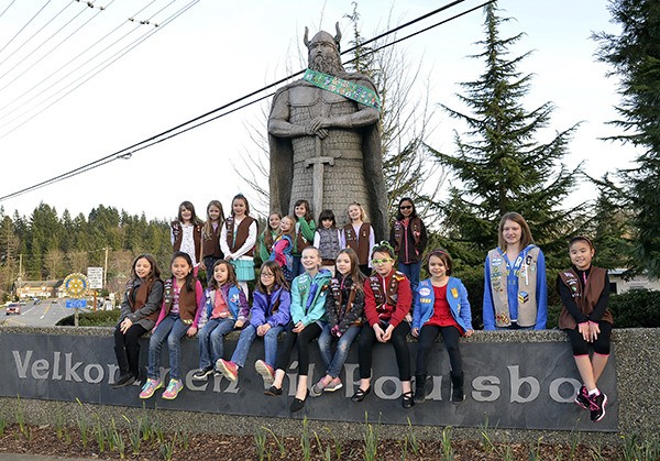Poulsbo and Kingston troops added a Girl Scout sash to the Norseman statue to announce the beginning of the annual Girl Scout Cookie Sale