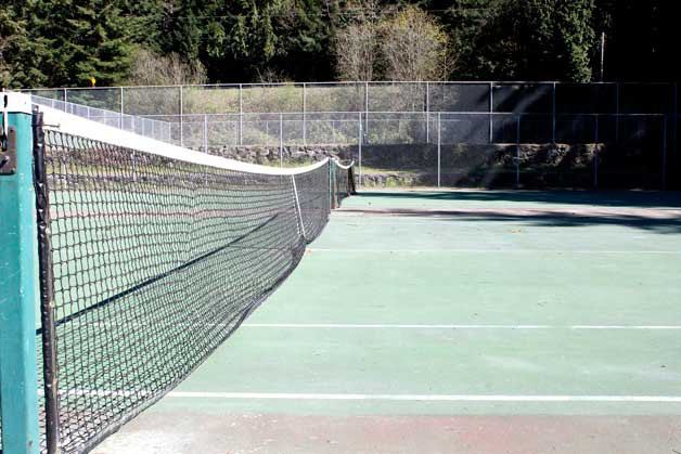 The tennis courts at the Kitsap Fairgrounds are faded and in need of repair.