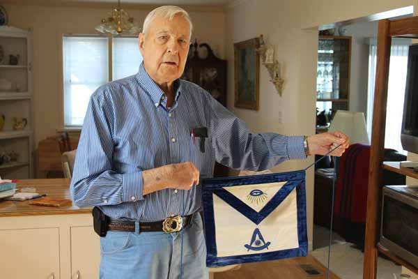 Glenn Haskin of Poulsbo displays his Masonic apron. His first job with the local lodge was lighting the building’s four oil stoves so the building would be warm when the Masons arrived.