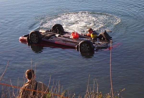 Rescuers work at the scene of a single-vehicle crash near the 3500 block of Tracyton Beach Road NW Jan. 1.