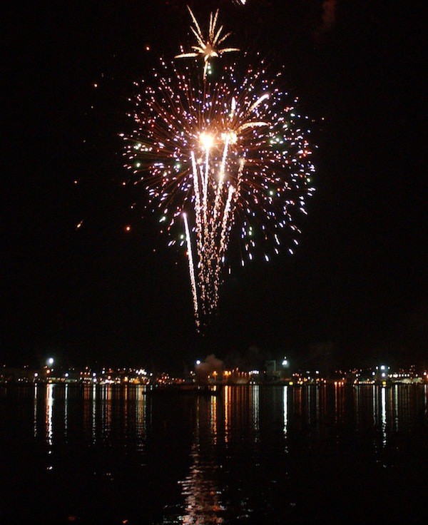 Firework explodes in the Sinclair Inlet during the Fathom's O' Fun Festival Grand Fireworks Show.