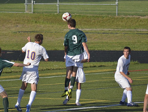 Shorecrest senior Anton Resing heads the ball in a 3-0 victory over North Kitsap to advance to the state quarter finals.