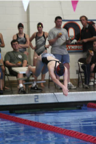 A member of CK’s 200-yard IM relay team leaps into the pool during South Kitsap’s 113-67 victory Tuesday.