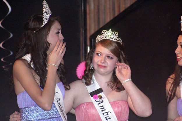 Kristine Ramsdell (left) and Tawnya Erickson (right) cried while posing for one of their final group pictures as royal ambassadors for Port Orchard.