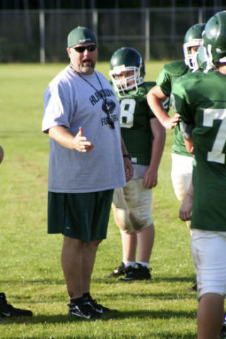 First-year Klahowya football coach Lyle Prouse gives instructions during the Eagles morning practice Thursday. The team opens the 2009 season Sept. 4 against Bremerton.