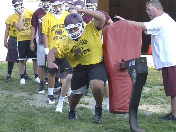 South Kitsap linemen go through blocking drills during the first day of practice Wednesday evening. The Wolves first game of the season is Sept. 5 at Central Kitsap.