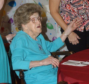 Lydia Simonson talks with people during her 103rd birthday party on Monday.