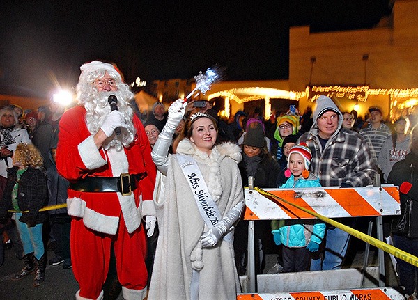 Santa Claus and Miss Silverdale 2015 Madison Gilmore count down the final seconds for the tree lighting  on Nov. 28.