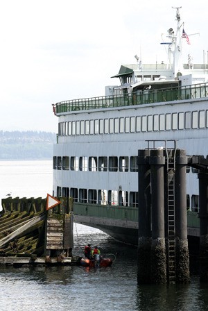 A dive crew inspects the ferry Spokane Monday afternoon in Kingston.