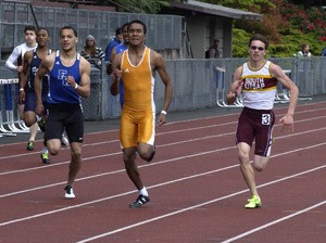 South Kitsap senior LaForrest Church (right) finished third in the 800-meter relay in 1 minute