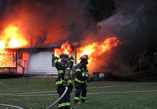 Fire destroys a manufactured home in Suquamish early Jan. 21. The home was fully engulfed in flames when North Kitsap and Poulsbo firefighters arrived.
