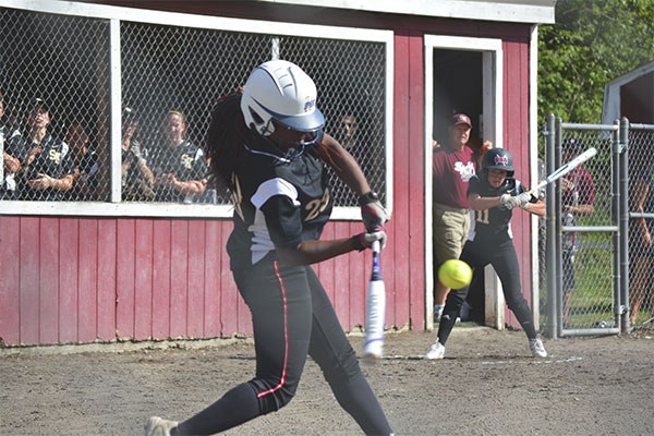 The South Kitsap High School softball team fell to Bellarmine Prep 4-2 on April 18. Third baseman Diavionne DeWalt hits a grounder before being thrown out at first base.