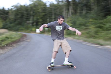 Freeborder Aaron Price carves down a hill in Hansville. The extra two wheels allow him to carve like a snowboard.