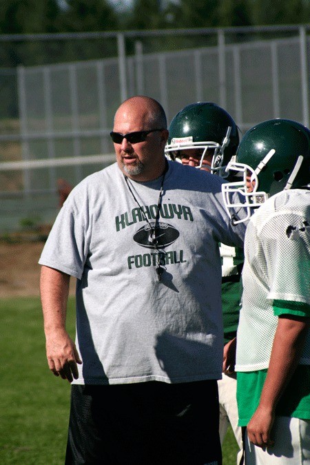 Klahowya Secondary School coach Lyle Prouse provides instruction during a practice in August.