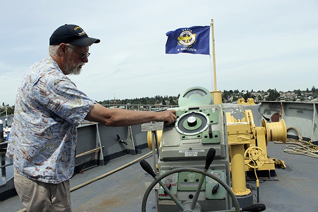 Comanche volunteer Joe Peterson shows off the tug’s rudder angle indicating system. Peterson is one of about 30 volunteers who spends time aboard the World War II-era tug fixing it up.