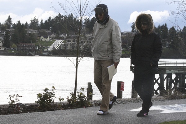 Rick and Ruth Richtmeyer stroll along the waterfront at Lions Park. The couple started an Adopt-a-Beach program to fight off invasive weeds so native species can thrive.