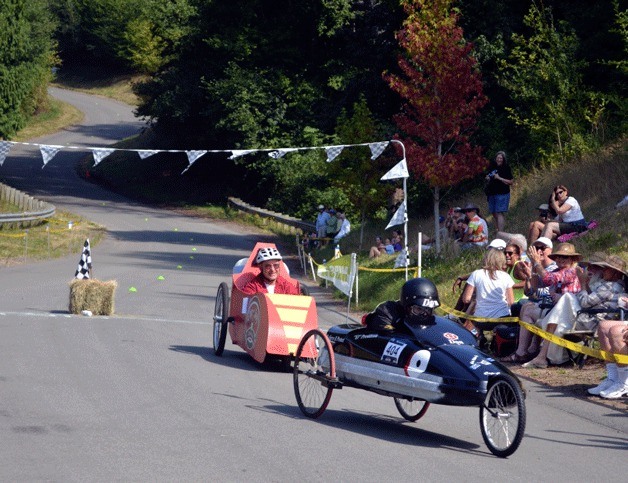 Don White and 'Coho Killer' (modeled after the fishing lure of the same name) holds on to his lead ahead of Chuck Hagood and 'Cup of Joy' in the 2014 Hansville Coaster Games race.