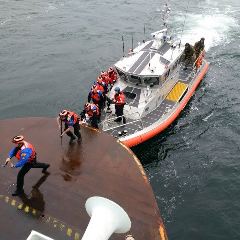 Law enforcement personnel board the Hyak during an exercise Feb. 10.