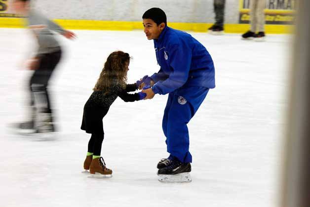 Children often get help skating from family at the Bremerton Ice Center during public skating Saturday