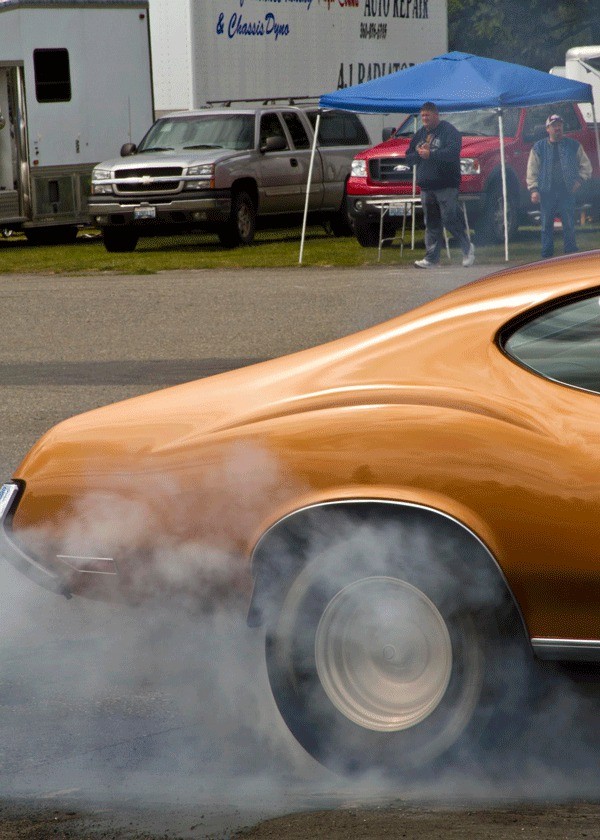 Rubber tires begin to smoke as a driver gets ready to race at the Bremerton Raceway