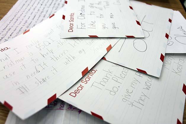 Letters from Cougar Valley Elementary students were gathered Tuesday in a pile to be submitted to the Macy's Believe campaign. For each letter received