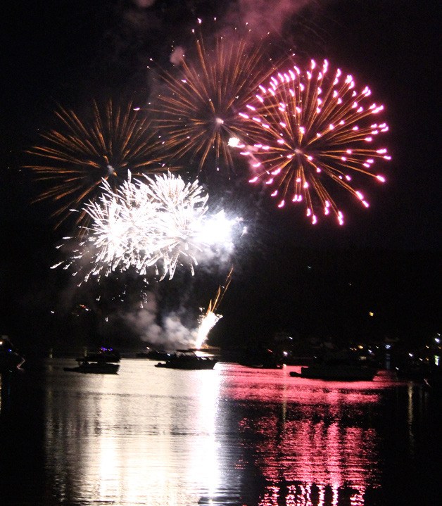Fireworks light up the sky over Liberty Bay to the delight of boaters and shoreline spectators during Poulsbo’s Third of July celebration.