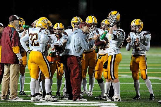 Kingston head coach Dan Novick discusses the Buccaneers' performance against the Lindbergh Eagles during halftime in November 2010 when the team went to the playoffs for the first time in program history.