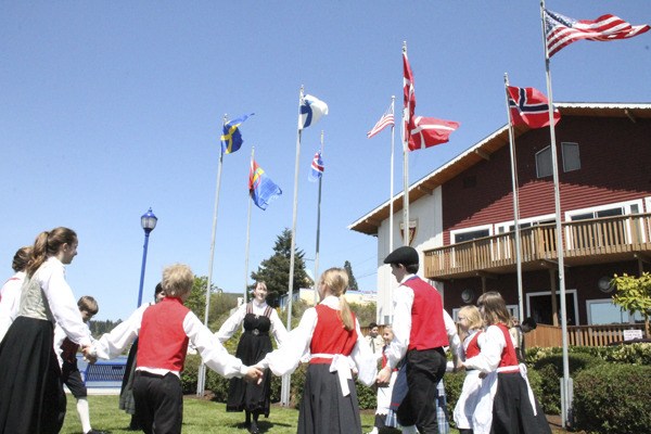 Sons of Norway youth dancers celebrate raising of Scandinavian flags