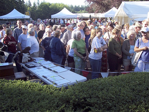 People waiting for the count down to drop the tape to get into the sales area at the Hansville Rummage Sale