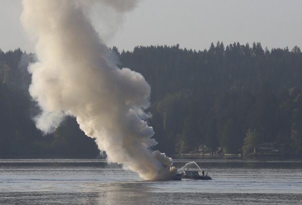 A 30-foot boat caught fire this morning by the Agate Pass bridge.