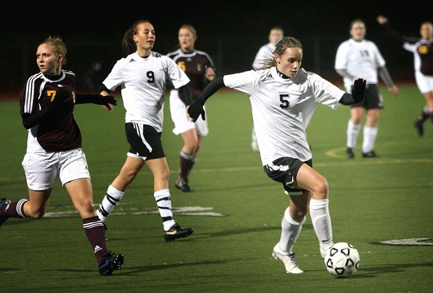 Klahowya Secondary School's Ruthie Hawley dribbles toward the goal during a 2009 playoff game.