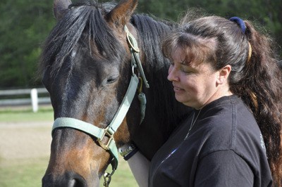 Trisha Byrd pets her 10-year-old horse
