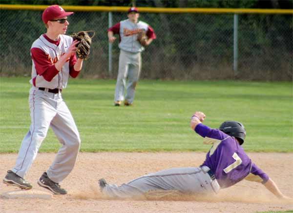 North Kitsap's Leif Klinger slides to second base as he's forced out