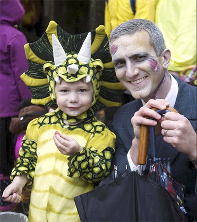Zombie Ian Eisenhood celebrates Oct. 31 with his son during downtown Bainbridge Island’s 2012 Halloween on Winslow Way.