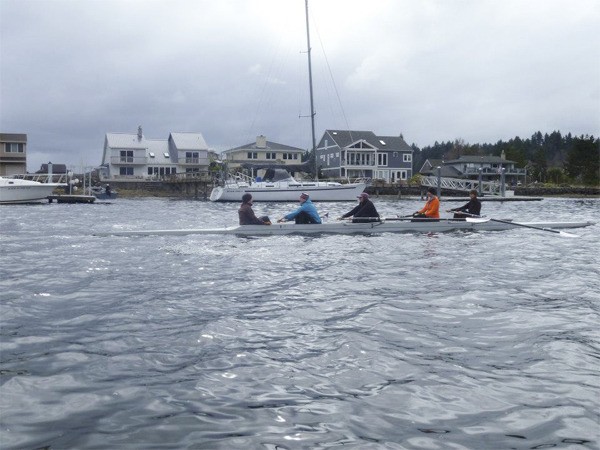 Members of the Kitsap Rowing Association practice on Miller Bay during the 2012 rowing season. The association is preparing to row at its new location on Liberty Bay this season.