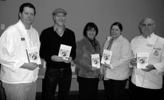The Washington State Chef’s Association recently donated cookbooks based on items found on the shelves of food banks to Poulsbo’s Fishline and Kingston’s ShareNet. Pictured from left to right are Christopher Plemmons