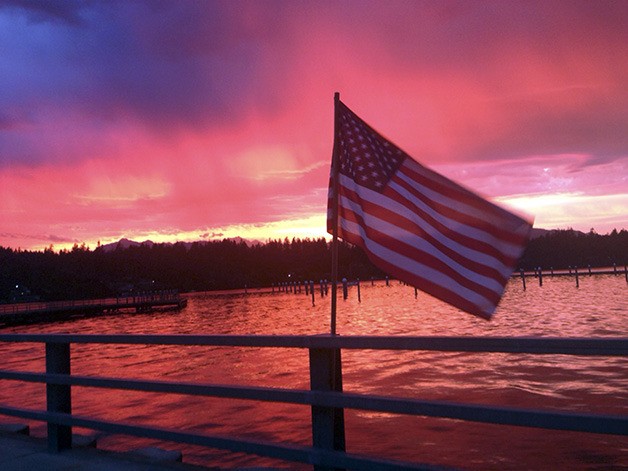 This past Sunday evening’s glorious sunset brought a magical glow to the Seabeck area. Amber Bumbalough snapped this photo of her family’s American flag.