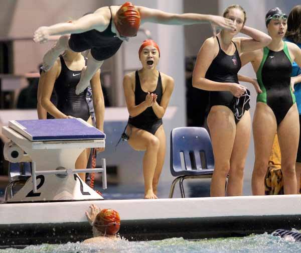 Kingston's Miranda Hoffer cheers on Nicole Avila in the 200 Medley Relay consolation finals Nov. 12 at the King County Aquatics Center during the 2A Girls Swim & Dive Championships.