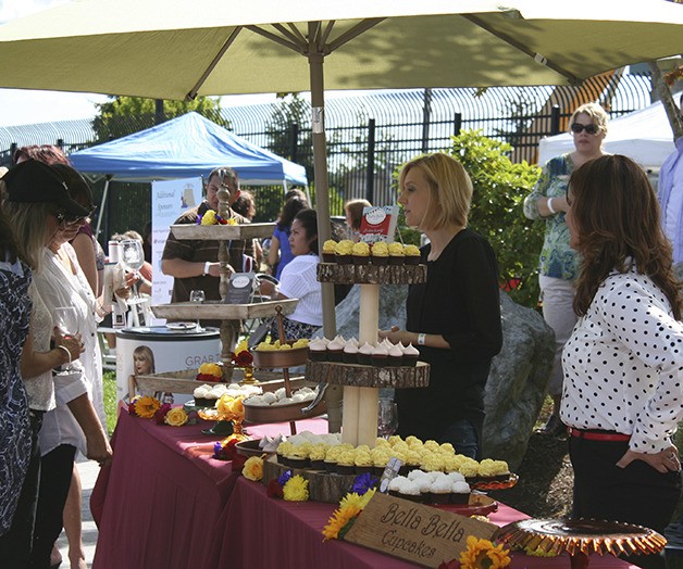 Several wine festival attendees found that cupcakes are among the sweet treats that go well with wine. More than 750 people attended the event last Saturday on the waterfront in downtown Bremerton.